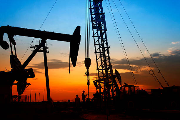 istock oil field, the oil workers are working 488574666