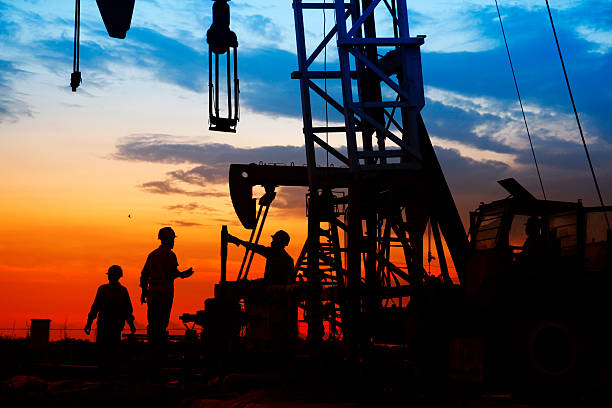 istock oil field, the oil workers are working 488574724