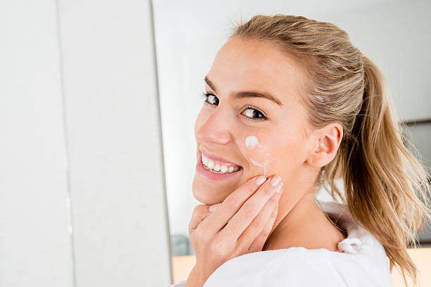 istock Woman cleansing her face 488574725