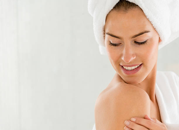 istock Woman stroking her skin 488574935