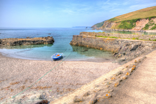 Single boat Portwrinkle harbour Whitsand Bay Cornwall England HDR near Looe in HDR