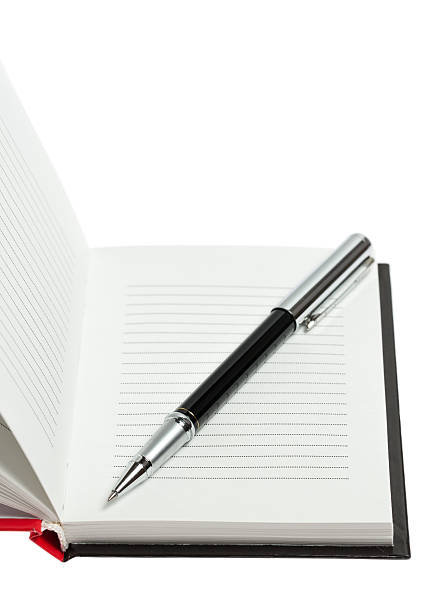 istock Part of opened notepad with pen. Isolated 488576333