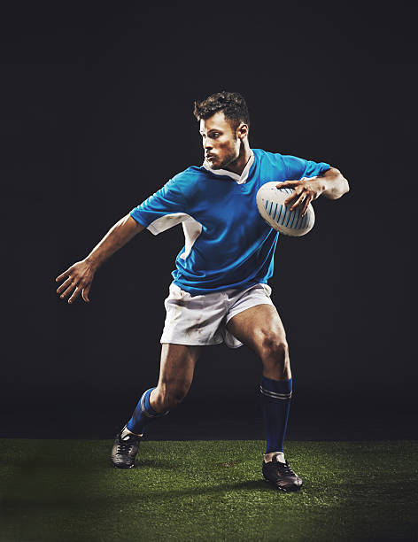 He's giving his all Full length studio shot of a young rugby player on the fieldhttp://195.154.178.81/DATA/i_collage/pi/shoots/784173.jpg rugby players stock pictures, royalty-free photos & images