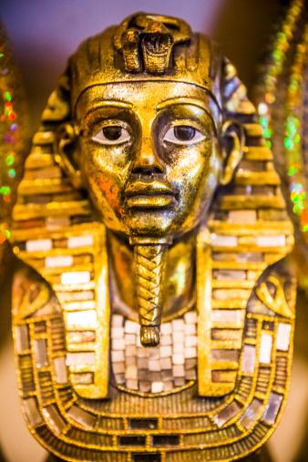 Tutankhamun's golden burial mask on black bacground. King Tut.