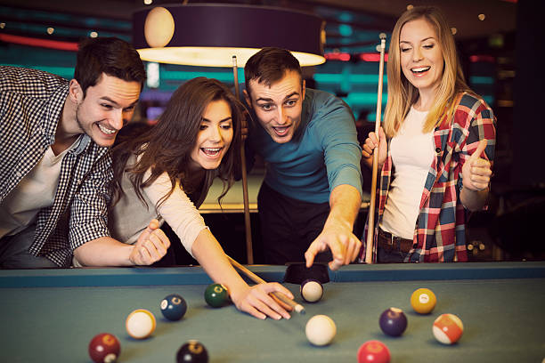 Friends Cheering While Their Friend Aiming For Billiards Ball Stock Photo -  Download Image Now - iStock