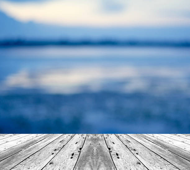 istock old white painted wood in front of sky in evening 488579084