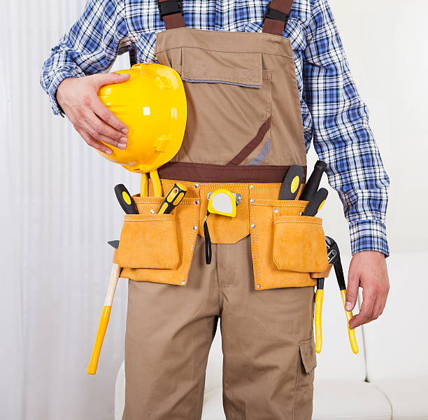 istock Repairman Holding Drill Machine In Living Room 488579564