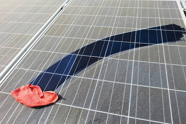 Cleaning of solar panels stock photo