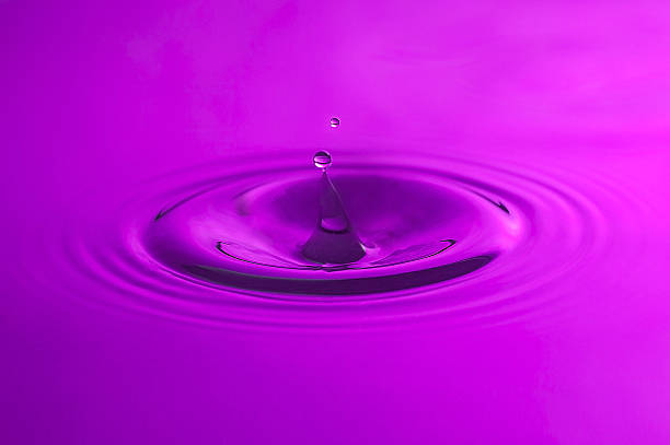 istock Purple Water drop close up. 488580818