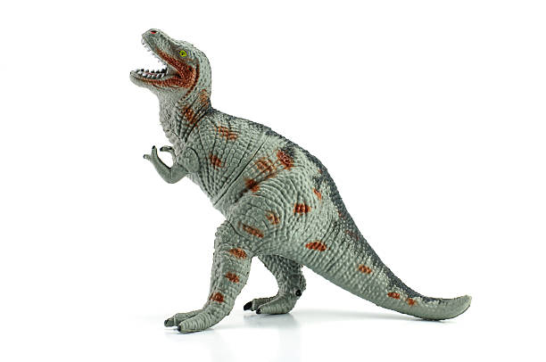 istock Tyrannosaurus toy isolated on white 488591951