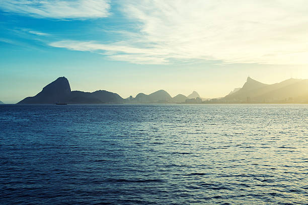 Sugarloaf Mountain Guanabara Bay Rio from Niteroi Scenic sunset view of Sugarloaf Mountain and mountain geography from across Guanabara Bay in Niteroi Rio de Janeiro Brazil guanabara bay stock pictures, royalty-free photos & images