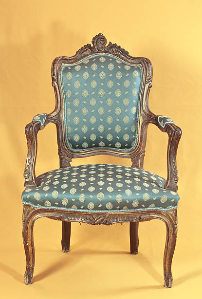 Elegant armchair in living room with curtains, decoration and furniture