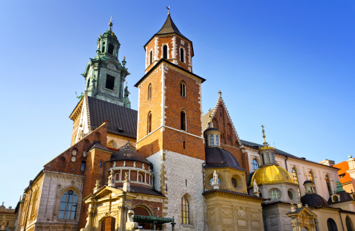 The Cathedral of Royal Wawel Castle against blue sky in Cracow, Poland. Wawel Royal Castle inscribed on the UNESCO World Heritage List.