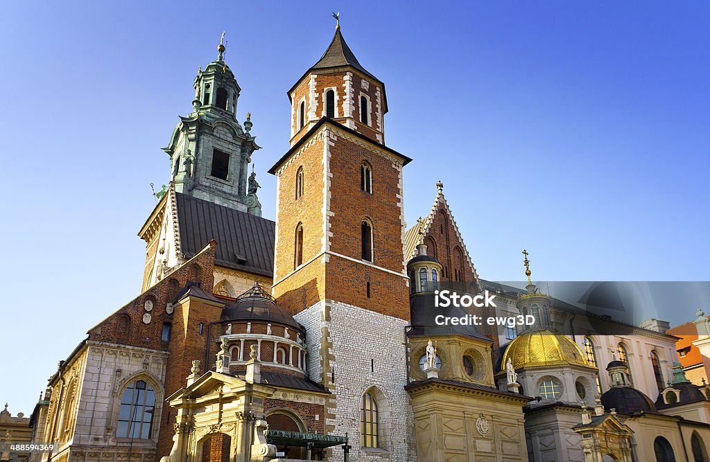 Wawel Royal Castle in Cracow, Poland The Cathedral of Royal Wawel Castle against blue sky in Cracow, Poland. Wawel Royal Castle inscribed on the UNESCO World Heritage List. Royal Castle - Warsaw Stock Photo