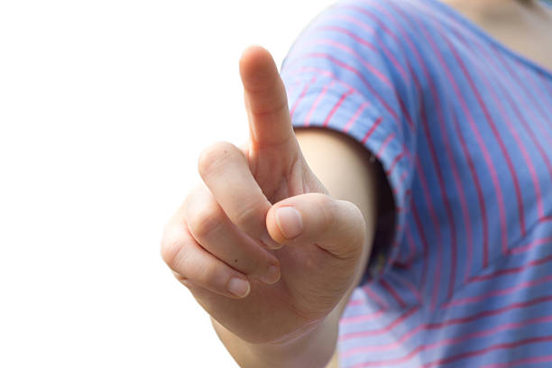 istock Woman touching an imaginary screen with her finger - isolated 488595509