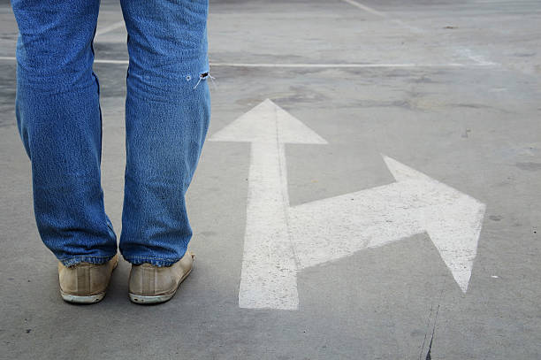 istock male with jeans and white direction arrow 488595573