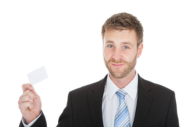 istock Happy Businessman Holding Visiting Card 488595946