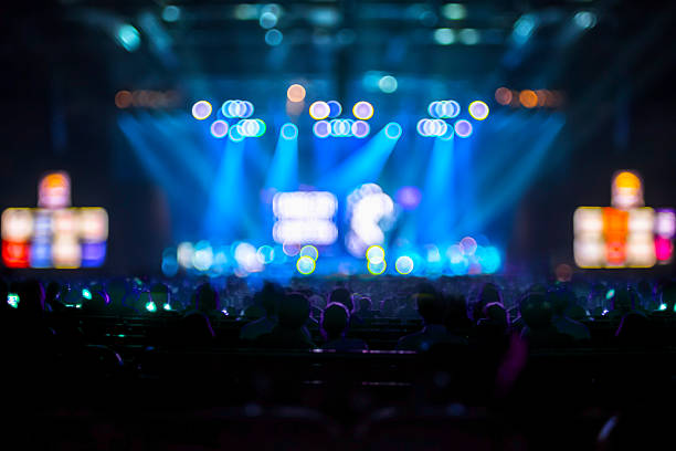 istock Blurred background : Bokeh lighting in concert with audience ,Mu 488596046