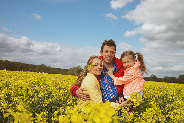 istock happy family outdoor in rape field 488596261