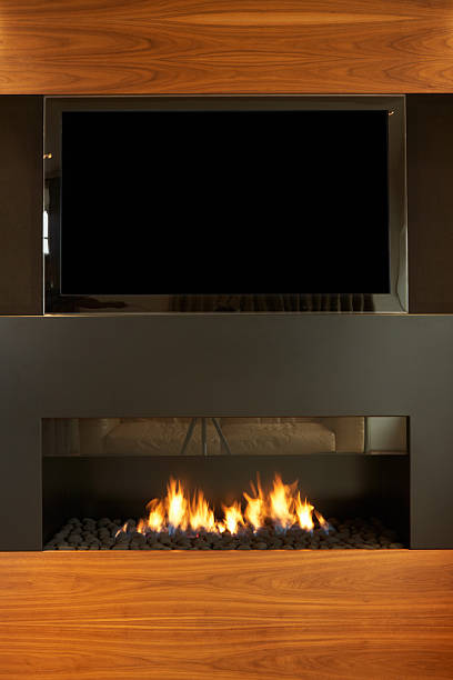 istock Lounge In Modern Home With TV And Fireplace 488597175