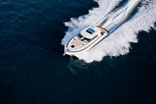 Luxurious yacht cruising through the sea stock photo