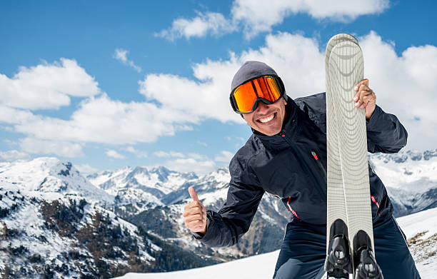 Man enjoying skiing Happy man enjoying skiing and having a lot of fun thumbs up for skiing stock pictures, royalty-free photos & images
