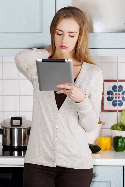istock Beautiful caucasian woman holding tablet. 488599775