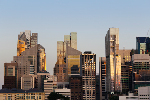 View of the Singapore financial district and skyscrapers from Chinatown in sunset 