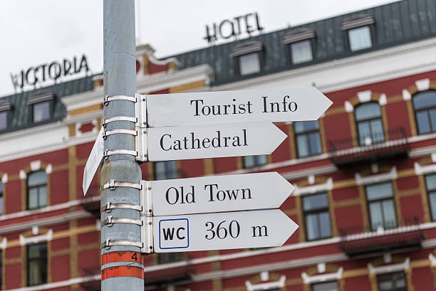 Stavanger - Norway Stavanger, Norway - May 27, 2015: View of a directional sign with a hotel building in the background   by the harbor close to the city center in Stavanger, Norway stavanger cathedral stock pictures, royalty-free photos & images