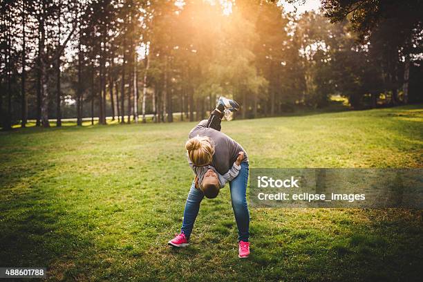Playing With Mom Stock Photo - Download Image Now - 2015, Adult, Autumn