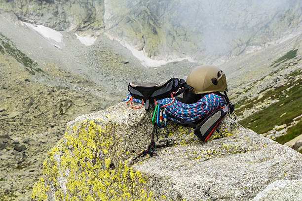 istock Dynamic rope, helmet, carabiners and other on the rock 488601942