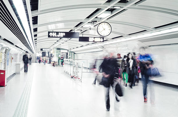 istock business people crowd walk at subway station abstract Blurred Mo 488602076