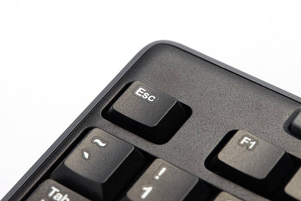 parte del teclado con llave de esc - resting computer key break red fotografías e imágenes de stock