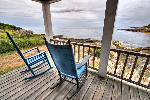 istock Rocking shairs on a porch with an ocean view 488611508