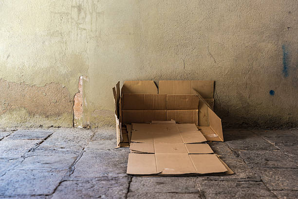 Bed made of cartons of a homeless man stock photo