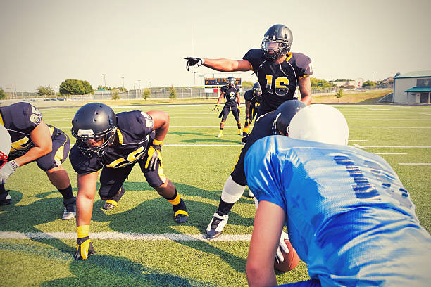 istock Quarterback calling an audible play during semi-professional football game 488614326