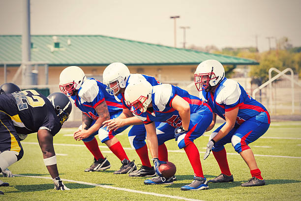 istock Semi pro football players lined up before play during game 488614360
