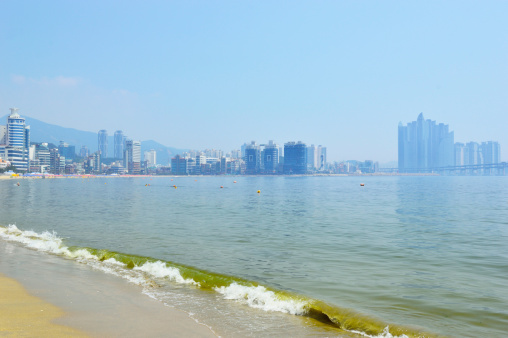 Gwangalli beach in the moring in Suyeong district in the background Diamond Bridge, Busan, South Korea