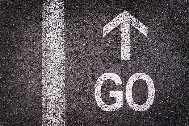 istock Word go and an arrow written on  asphalt 488615394