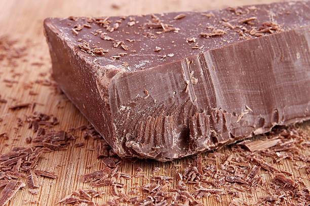 istock Big chunk of chocolate and shavings 488615679