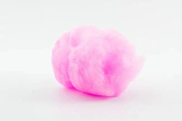 Closeup pink spun sugar on white background, Cotton Candy.