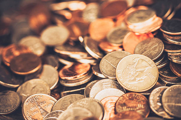 istock American currency coins background 488618358