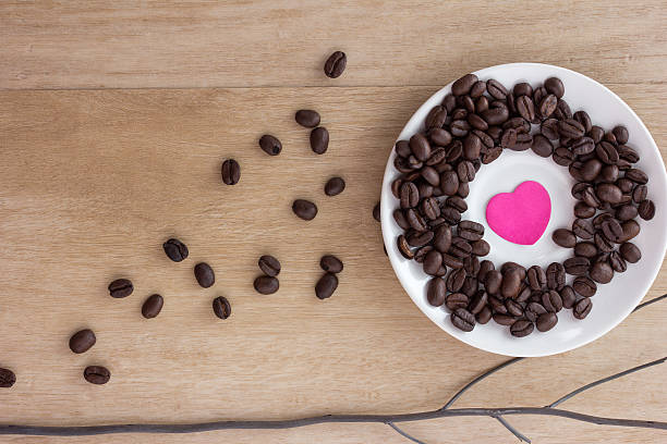 istock coffee beans on old wooden background 488623518