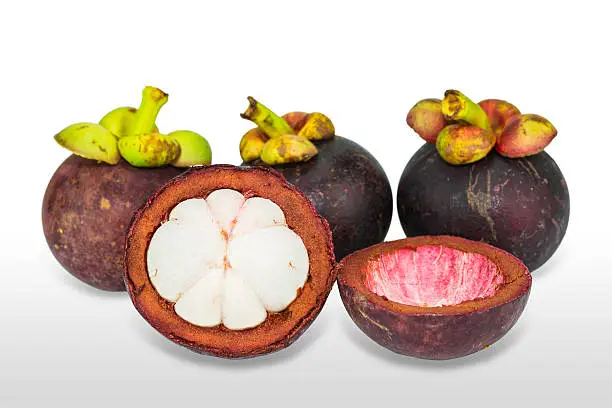 Close up of mangosteen fruits, isolated on white background with clipping path