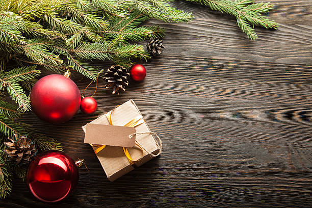 istock Christmas Tree and decorations on wooden background 488624332