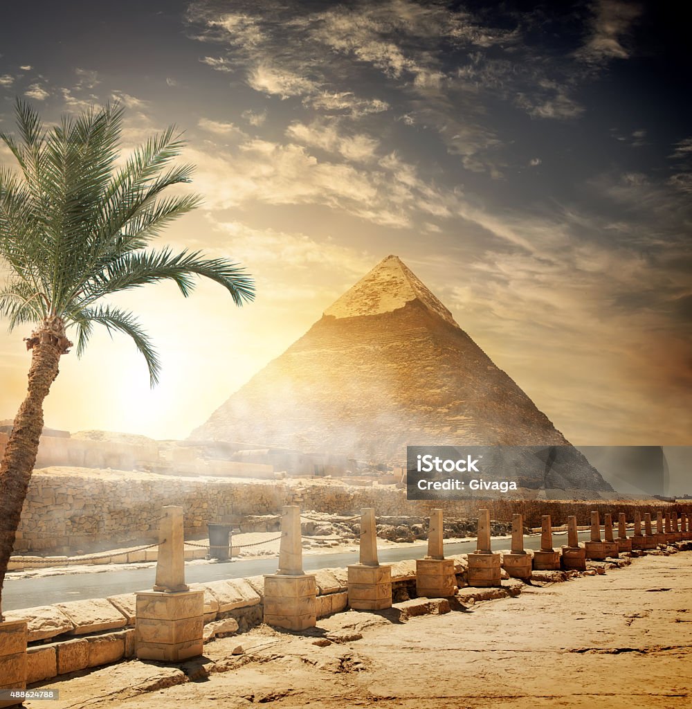 Pyramid of Khafre Pyramid of Khafre near road at sunlight Egypt Stock Photo