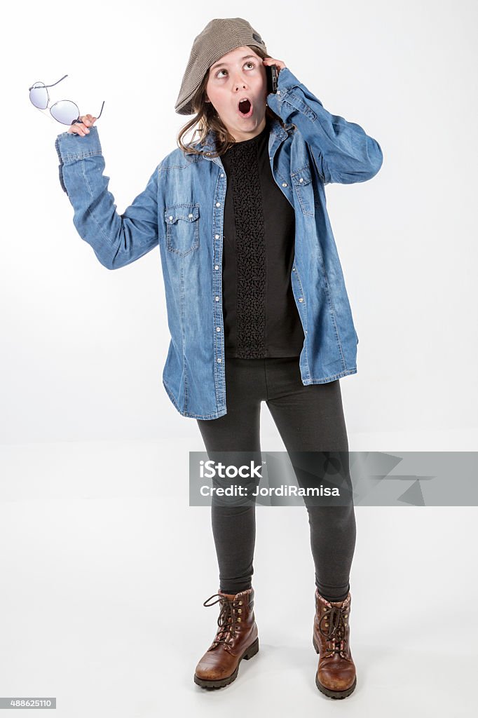 Teen talking Teenager speaking for telephone on white fund 12-13 Years Stock Photo