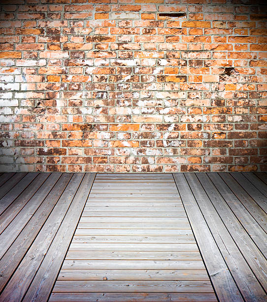 istock Old interior with colored brick wall and wooden floor 488626626