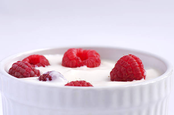 istock Natural yogurt with fresh raspberries 488627326