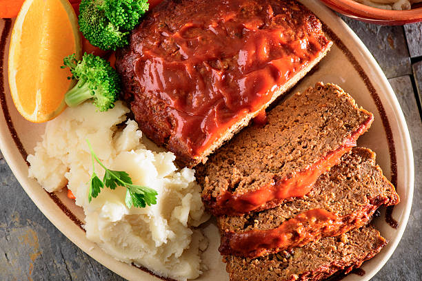 istock Fresh baked tomato glazed meatloaf served with mashed potato 488629942